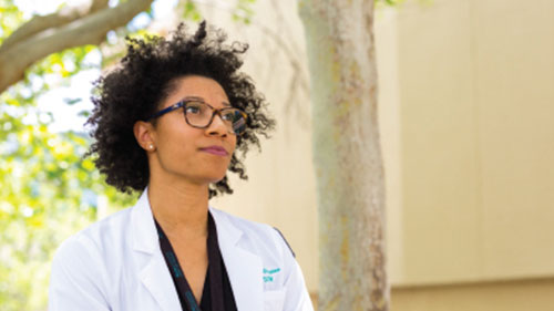 Photo of a female medical student looking away from camera